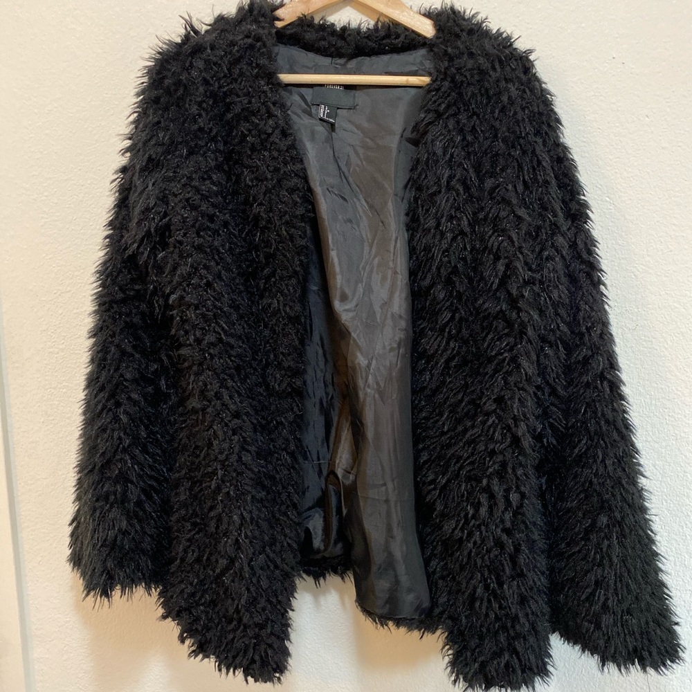 Fluffy black jacket. So cute.